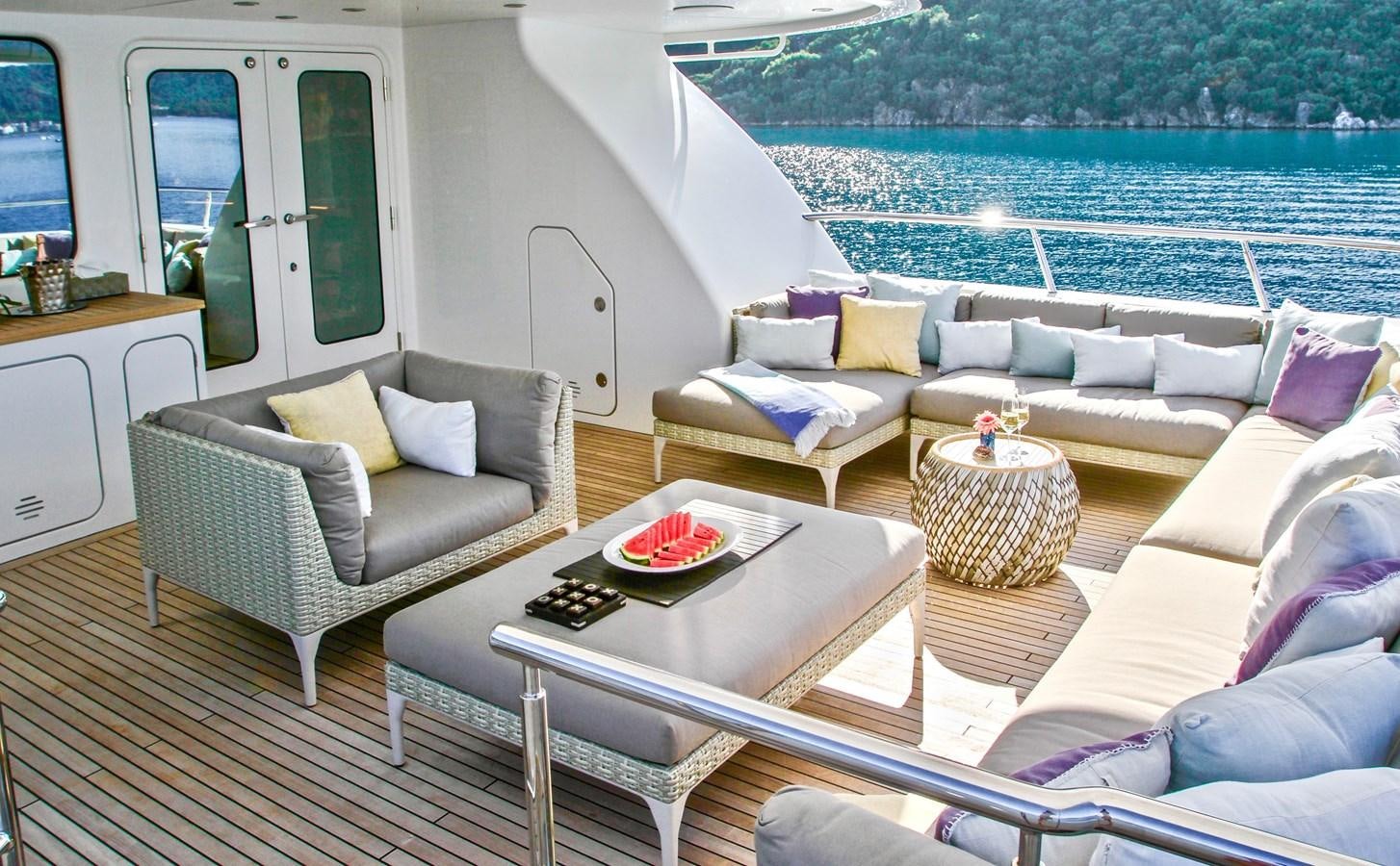 a living room with a couch and a table aboard BALTIC SEA Yacht for Sale