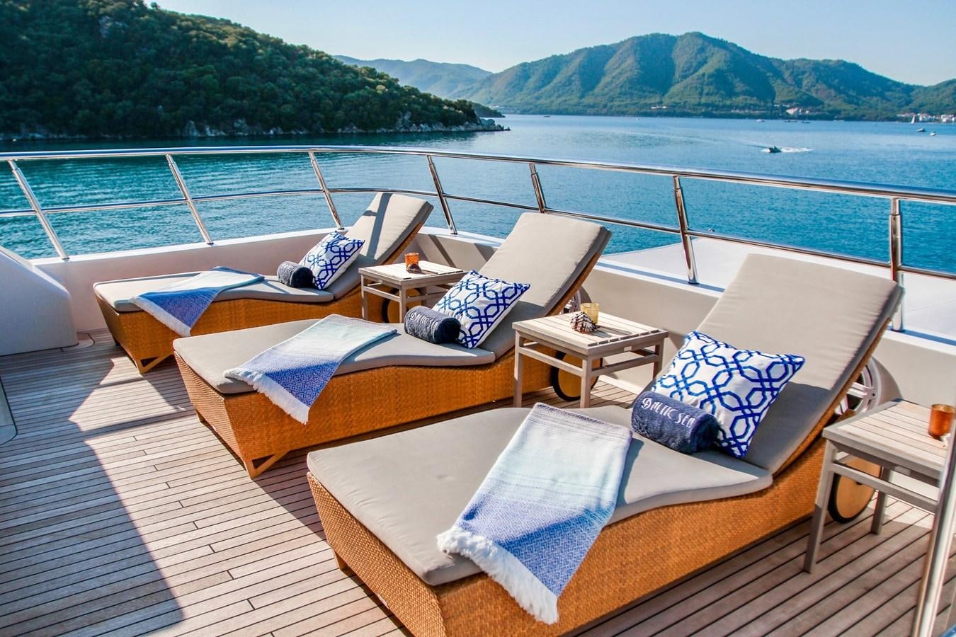 a deck with beds on it aboard BALTIC SEA Yacht for Sale