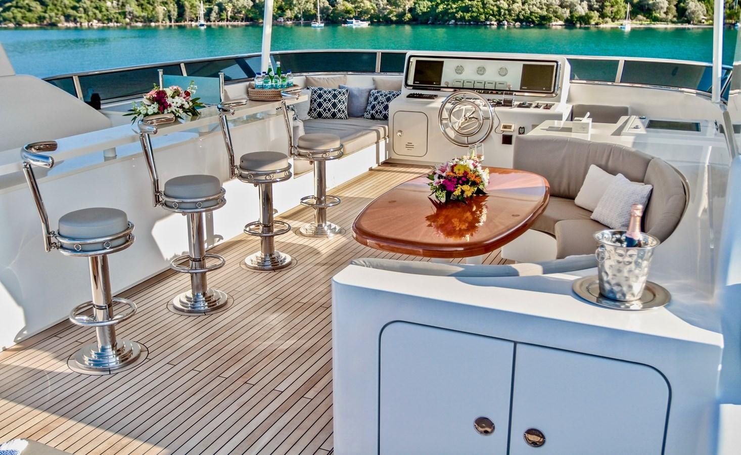 a room with a table chairs and a potted plant on a table aboard BALTIC SEA Yacht for Sale