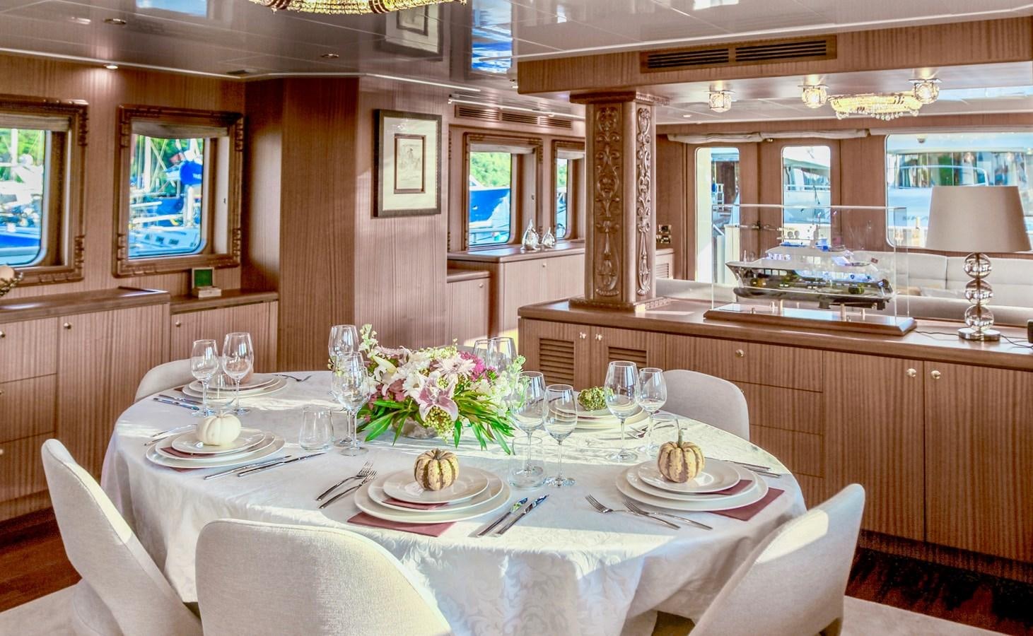 a dining room with a table set aboard BALTIC SEA Yacht for Sale
