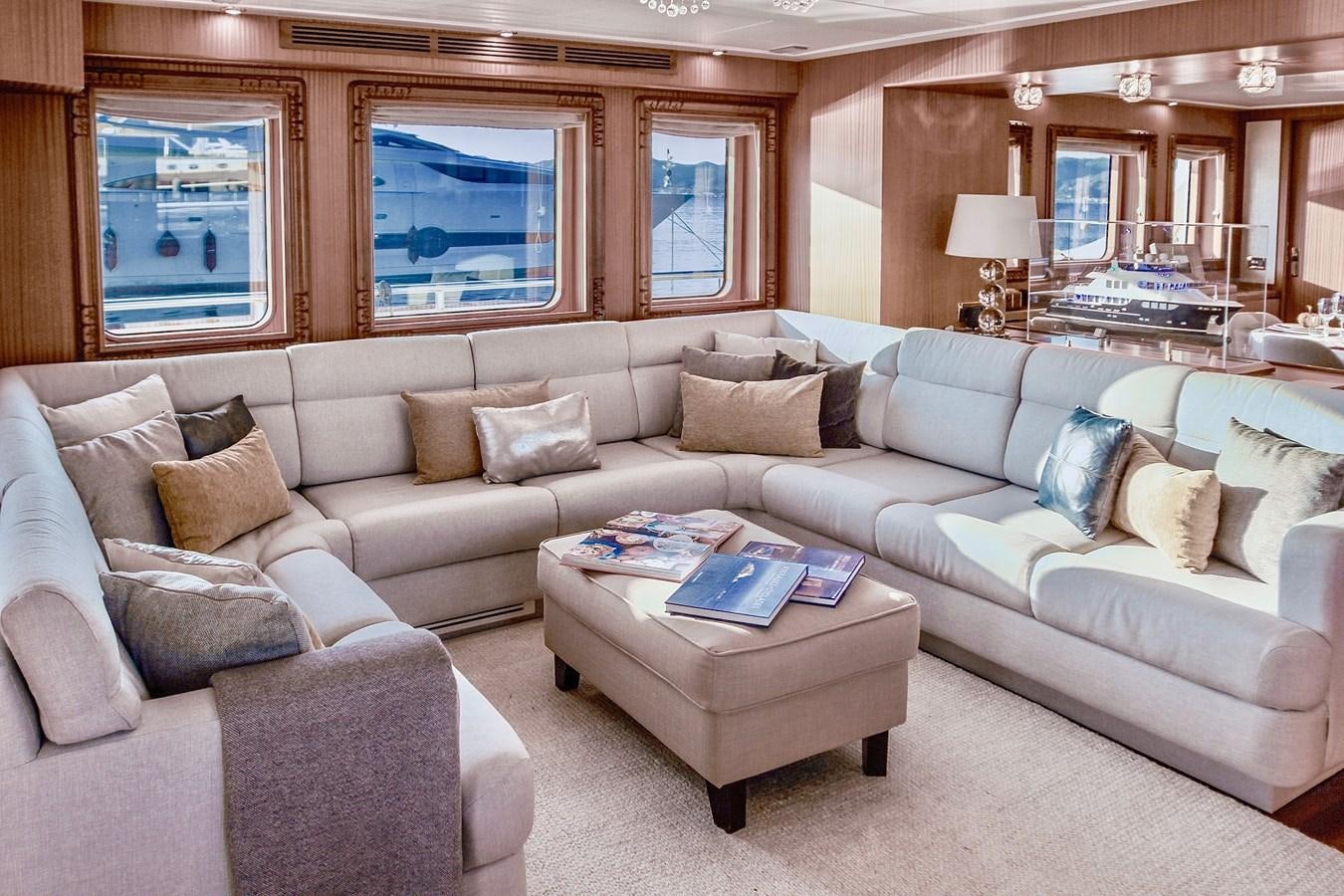 a living room with a couch and a coffee table aboard BALTIC SEA Yacht for Sale