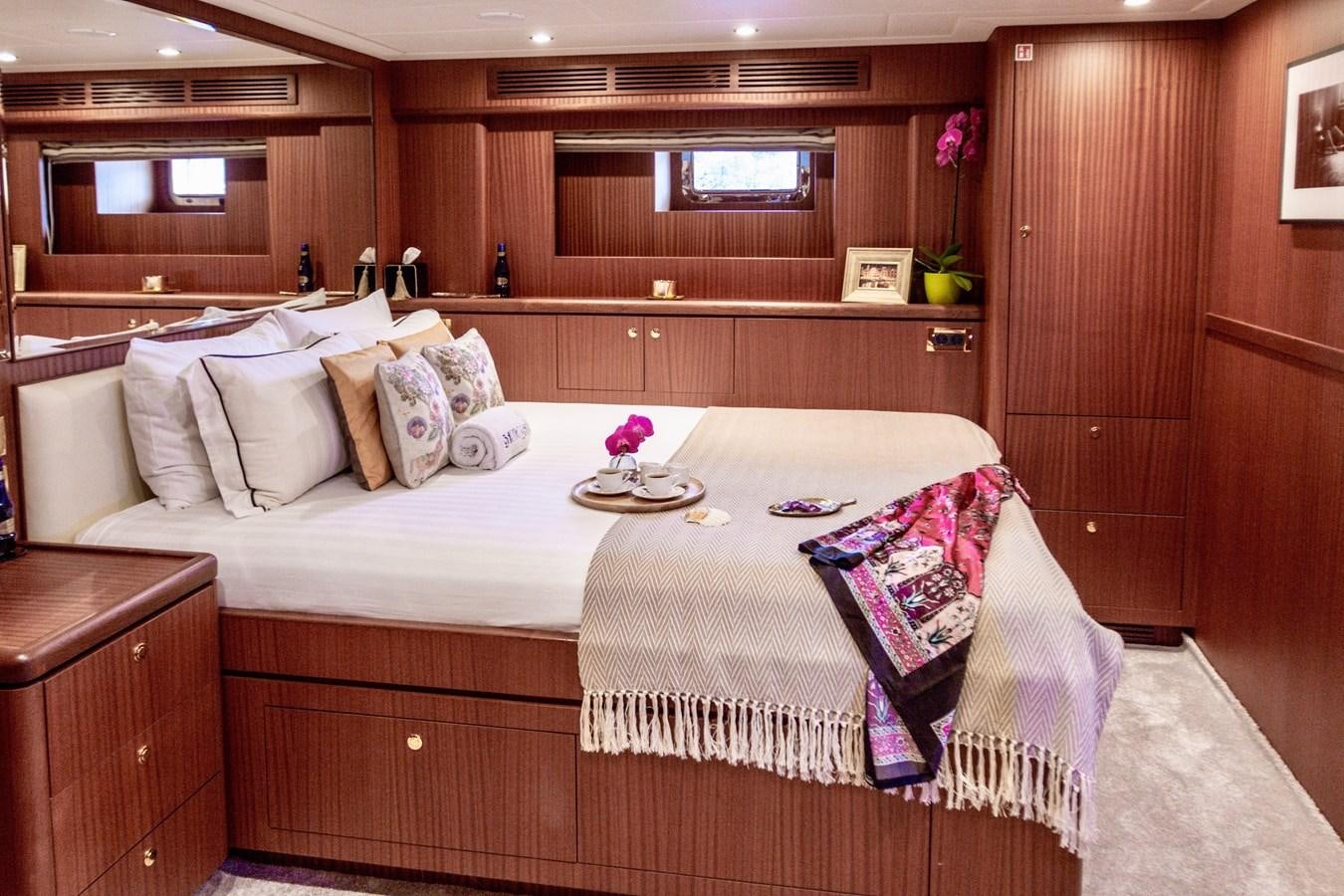 a bed with a tray on it aboard BALTIC SEA Yacht for Sale