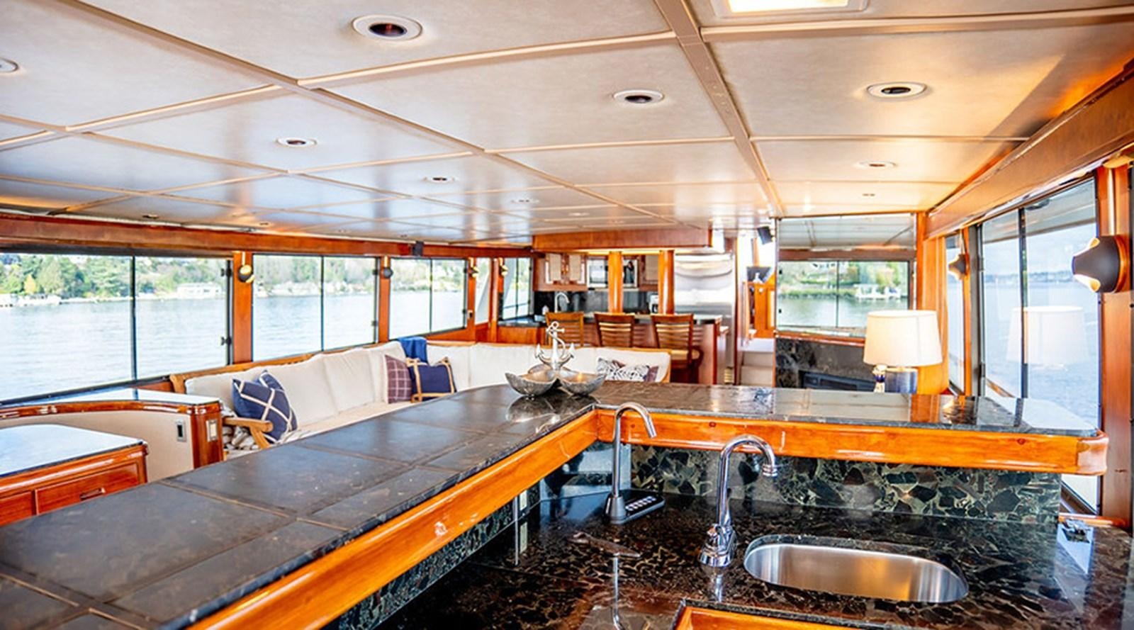 a kitchen with a large island aboard PACIFIC SHADOW Yacht for Sale