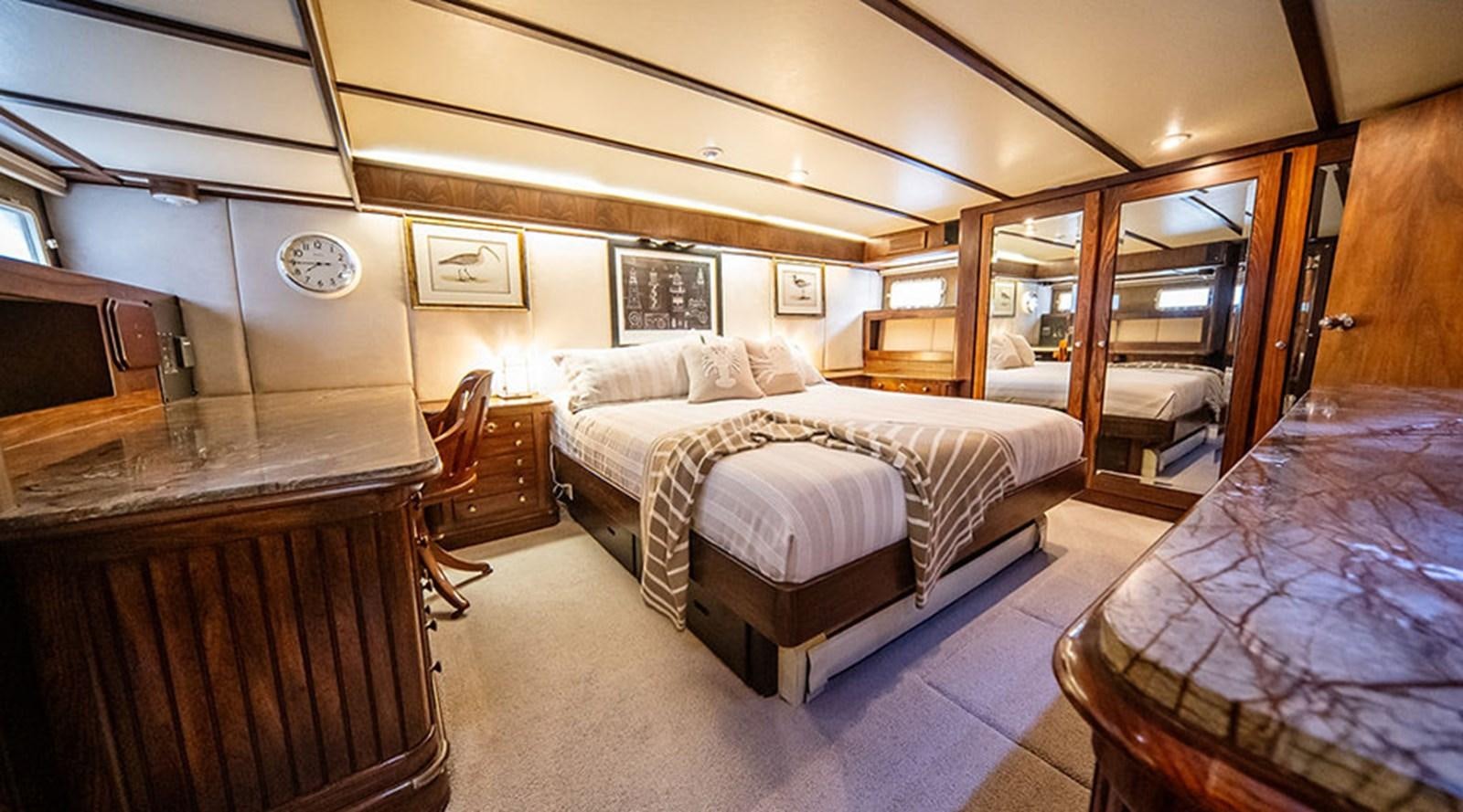 a room with a couple of beds aboard PACIFIC SHADOW Yacht for Sale