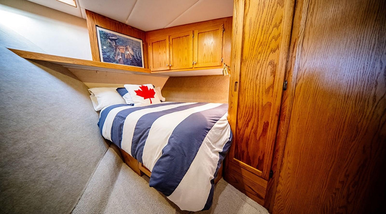 a bed in a room aboard PACIFIC SHADOW Yacht for Sale