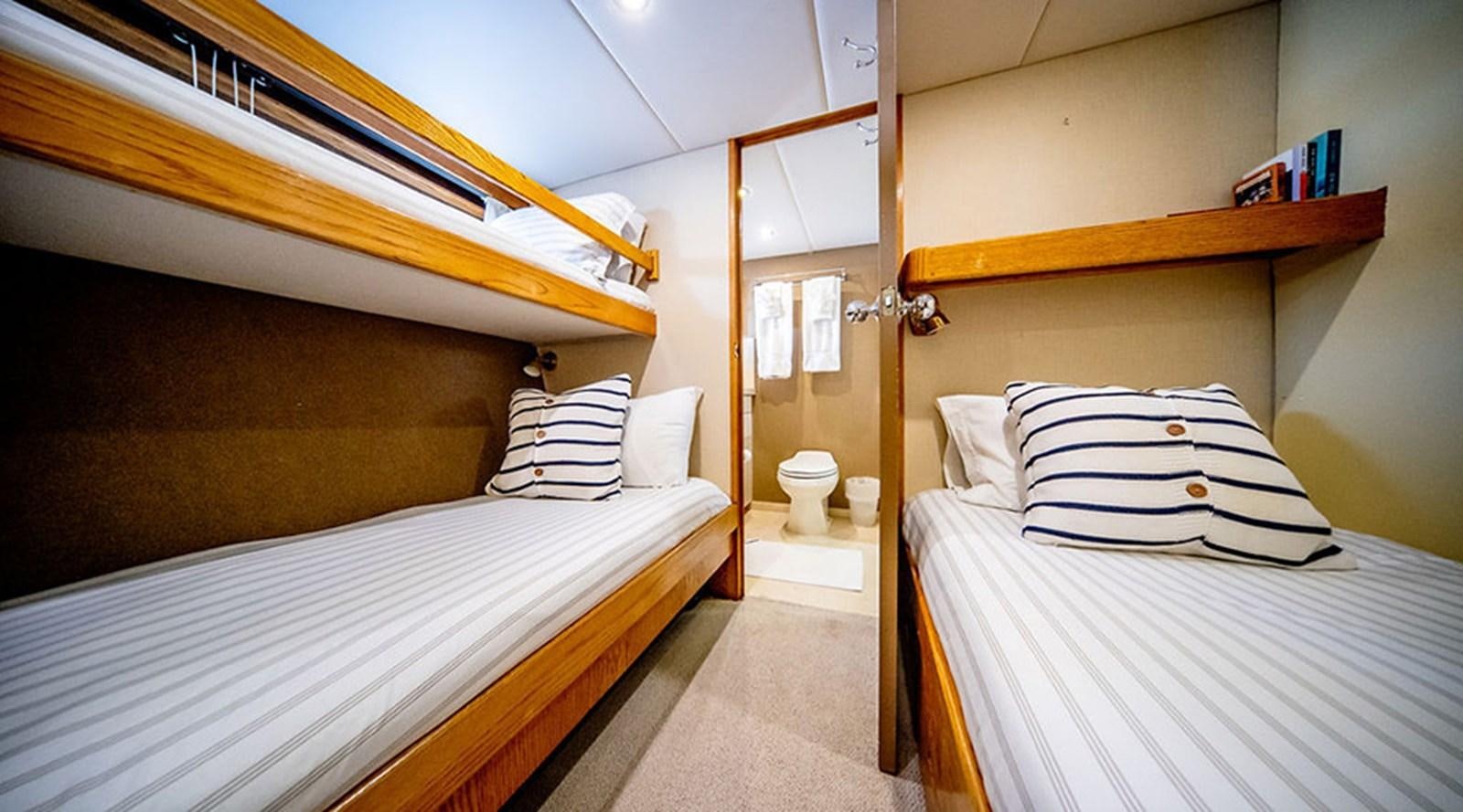 a room with two beds aboard PACIFIC SHADOW Yacht for Sale