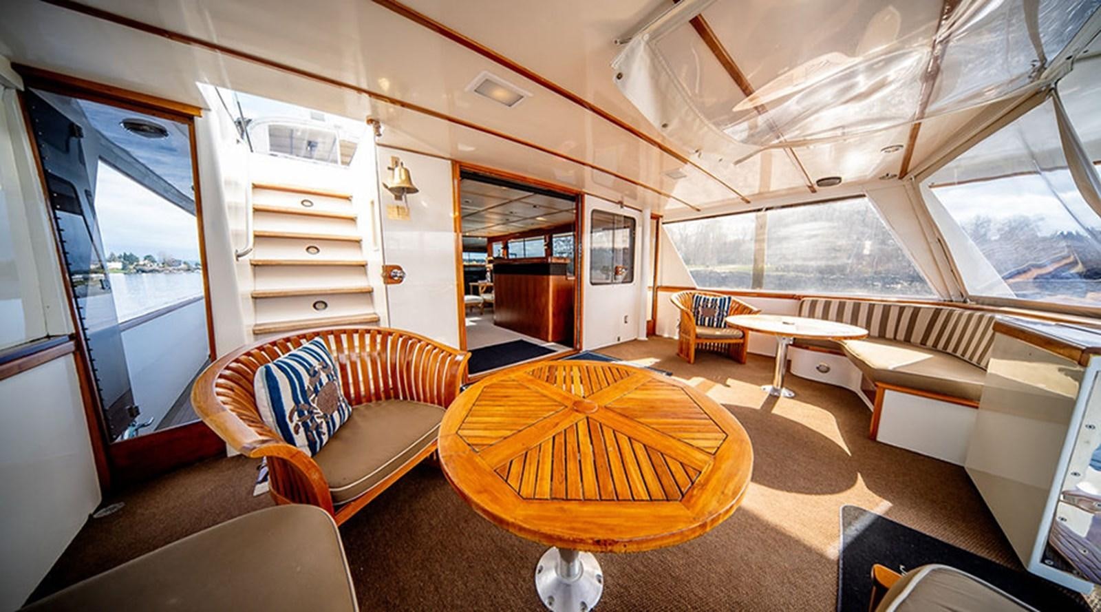 a room with a couch and a table aboard PACIFIC SHADOW Yacht for Sale