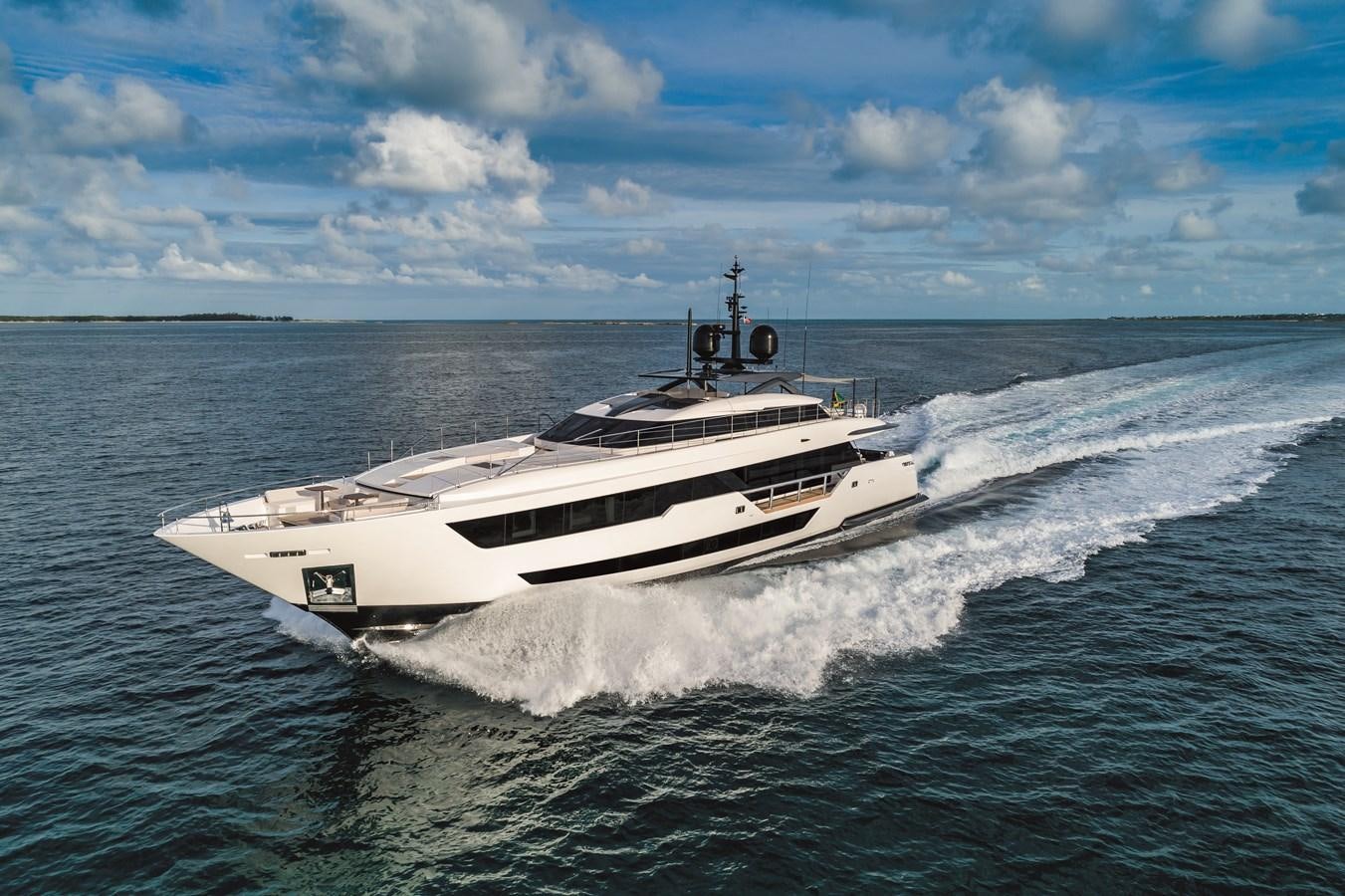 a white boat on water aboard NEVER BLUE Yacht for Sale