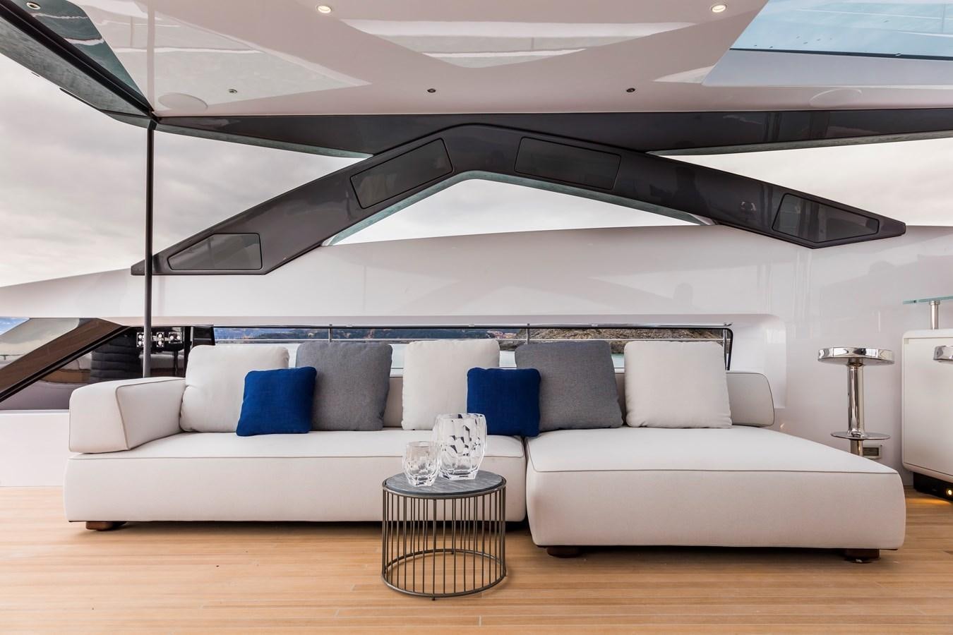 a white couch in a room aboard NEVER BLUE Yacht for Sale