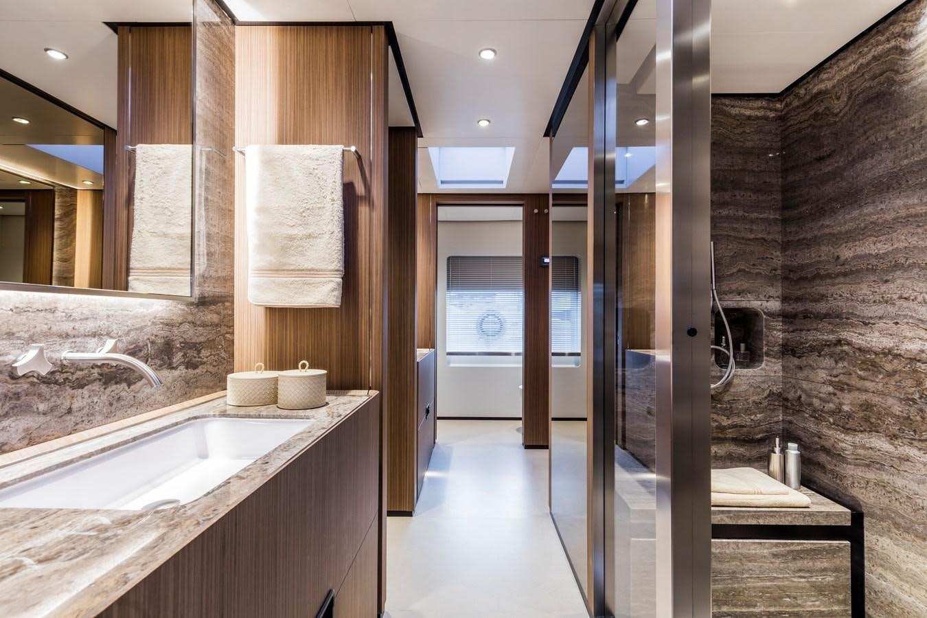 a bathroom with a sink and a mirror aboard NEVER BLUE Yacht for Sale