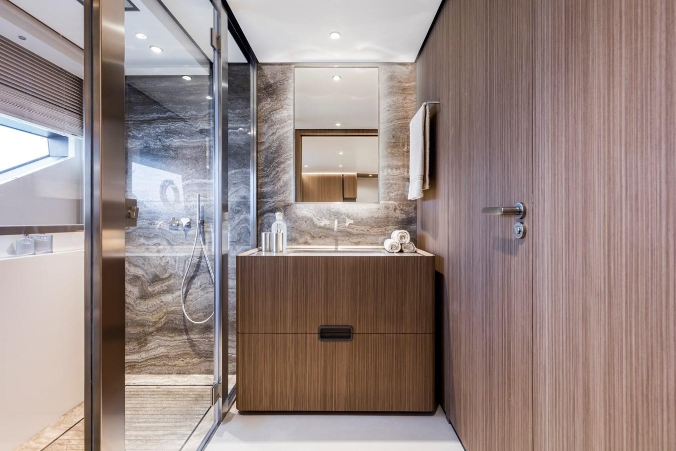 a bathroom with a glass shower aboard NEVER BLUE Yacht for Sale