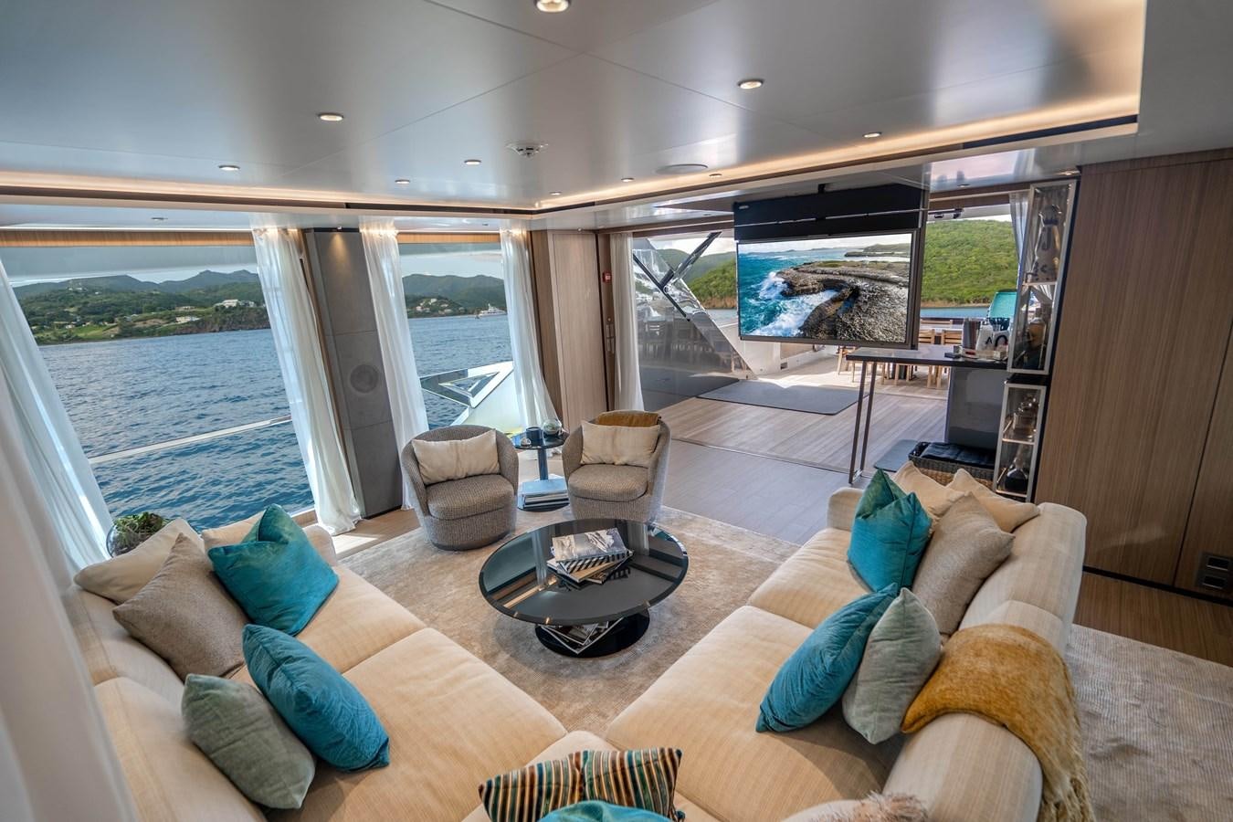 a living room with a large window aboard NEVER BLUE Yacht for Sale