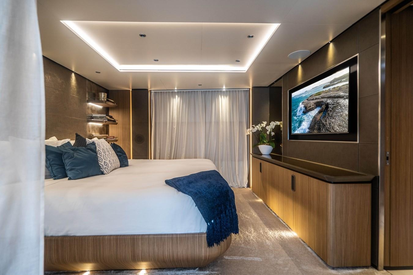 a bedroom with a large bed aboard NEVER BLUE Yacht for Sale