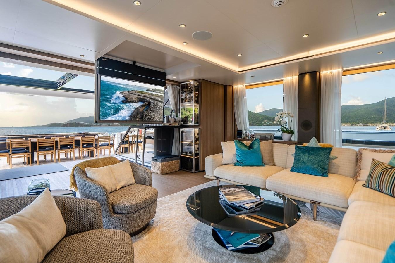 a living room with a large window aboard NEVER BLUE Yacht for Sale