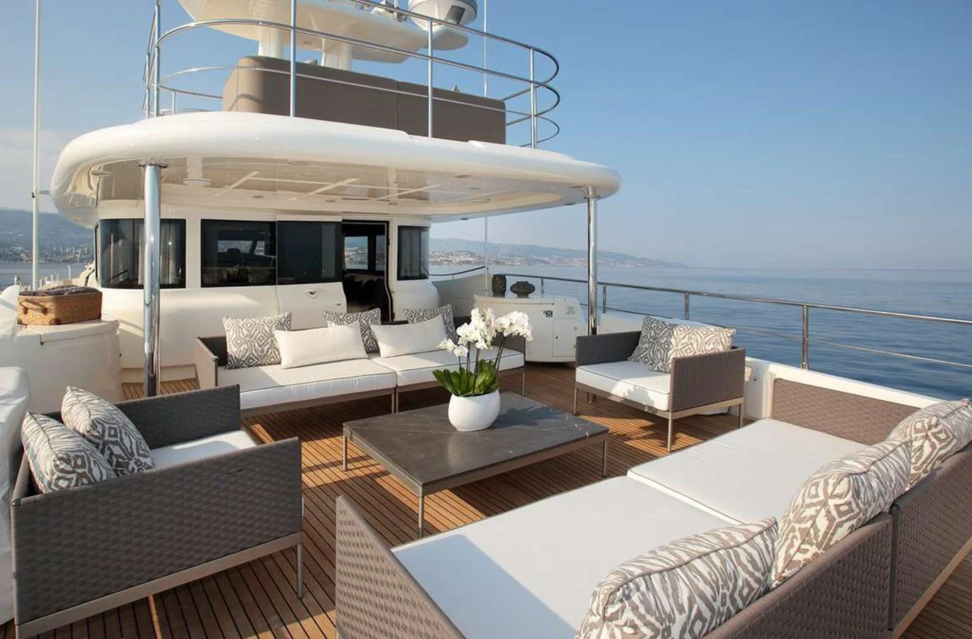 a living room with a large white boat on the deck aboard LADY SOUL Yacht for Charter