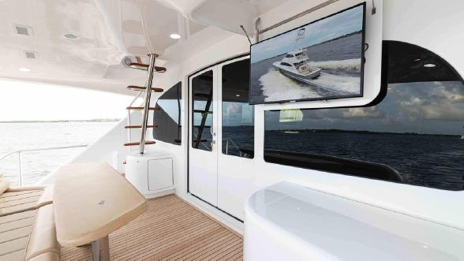 a white boat with a large window aboard MAKARA Yacht for Sale