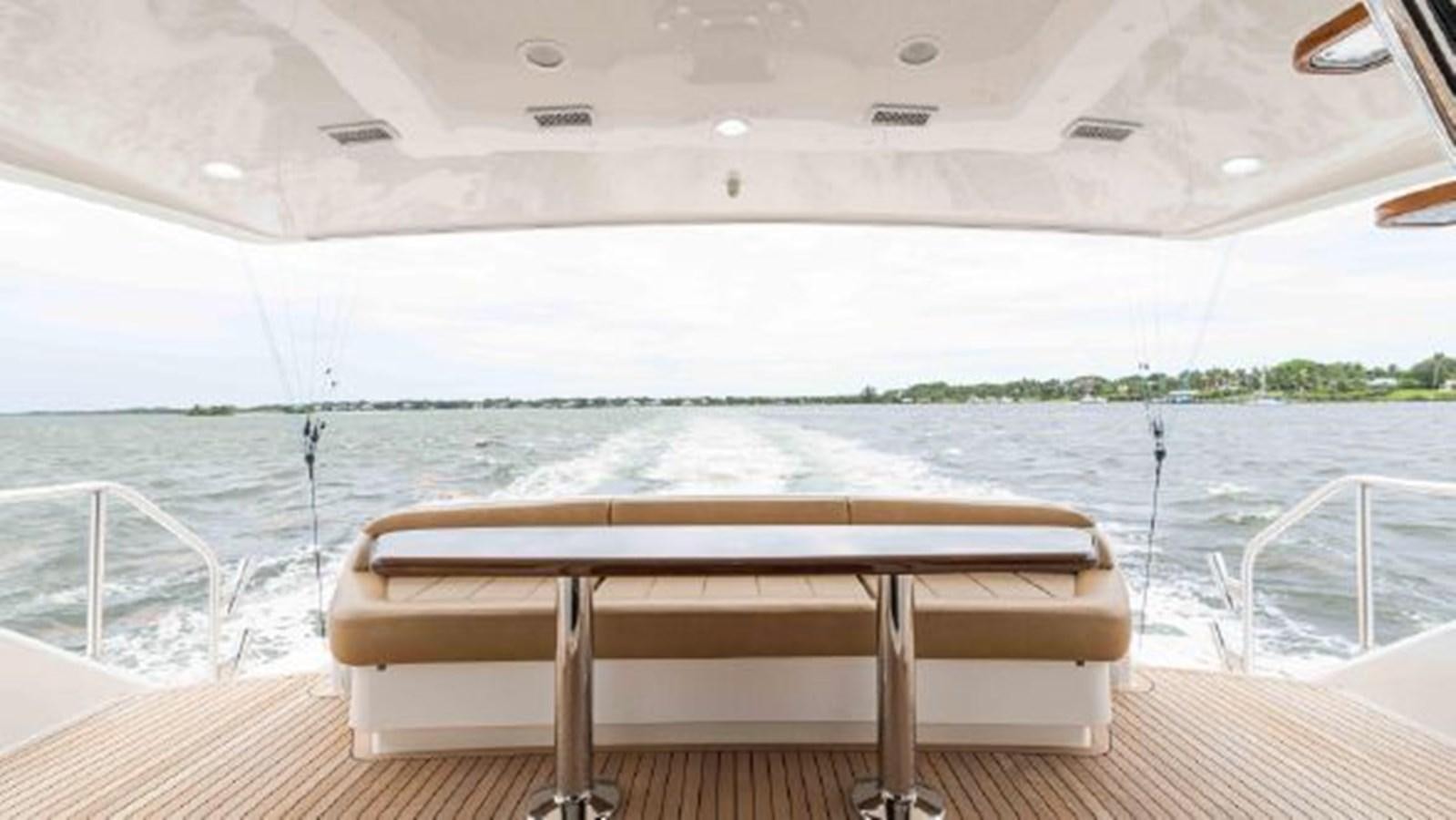 a wooden table on a boat aboard MAKARA Yacht for Sale