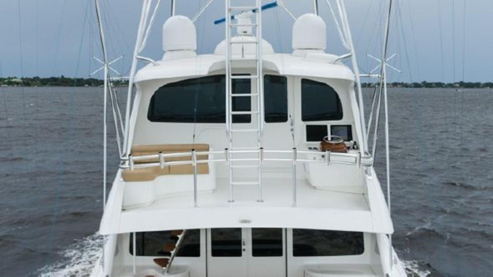 a white boat on the water aboard MAKARA Yacht for Sale