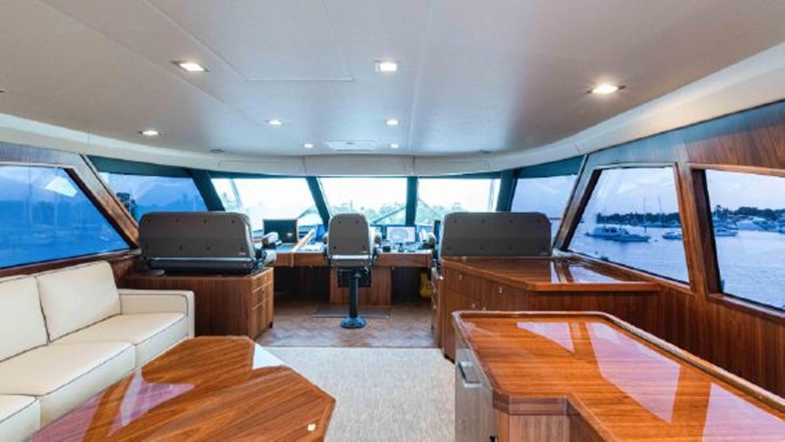 inside of a car with a large window and a view of the water aboard MAKARA Yacht for Sale
