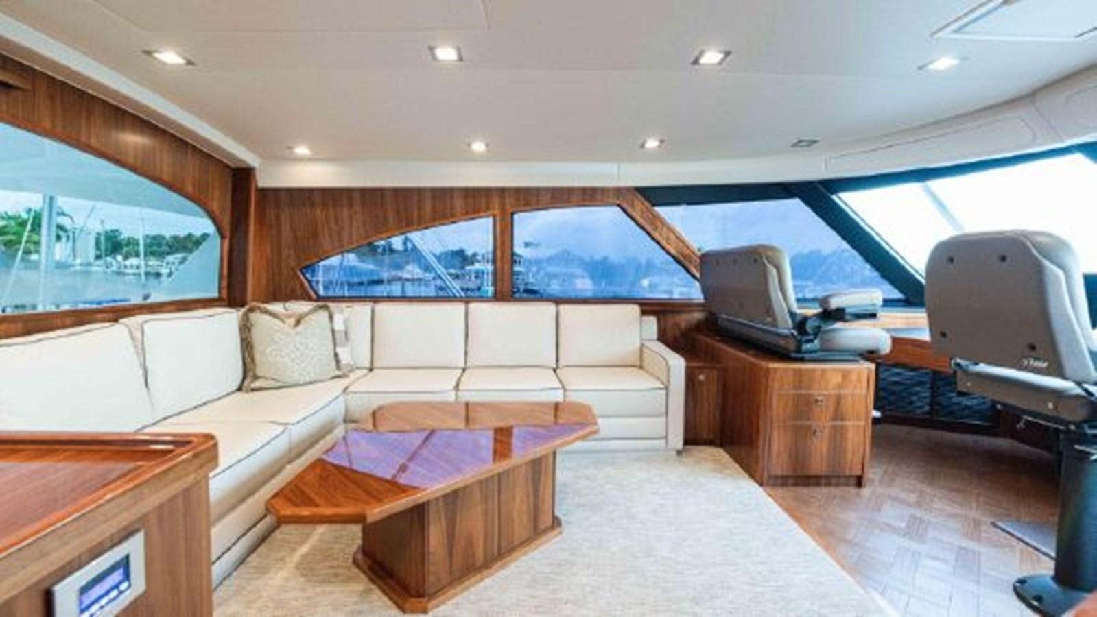 a living room with a couch and a television aboard MAKARA Yacht for Sale