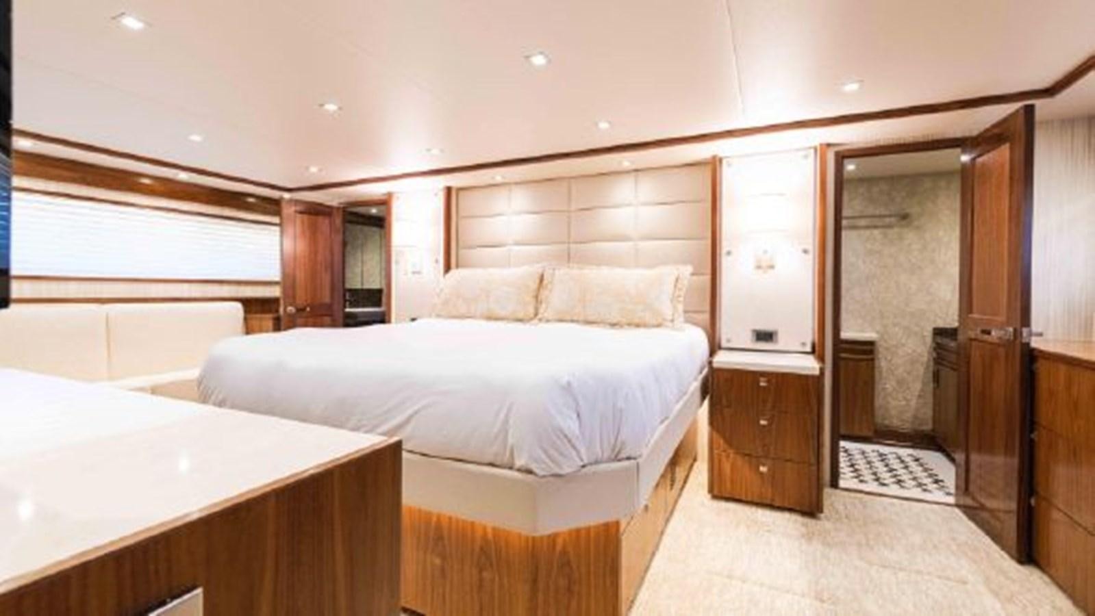 a bedroom with a bed and a closet aboard MAKARA Yacht for Sale