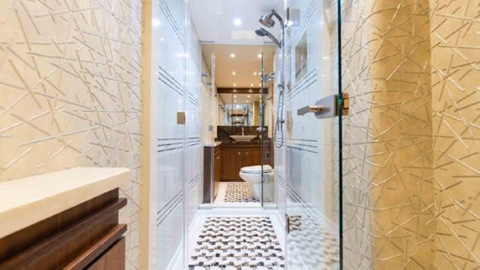 a bathroom with a toilet and a sink aboard MAKARA Yacht for Sale