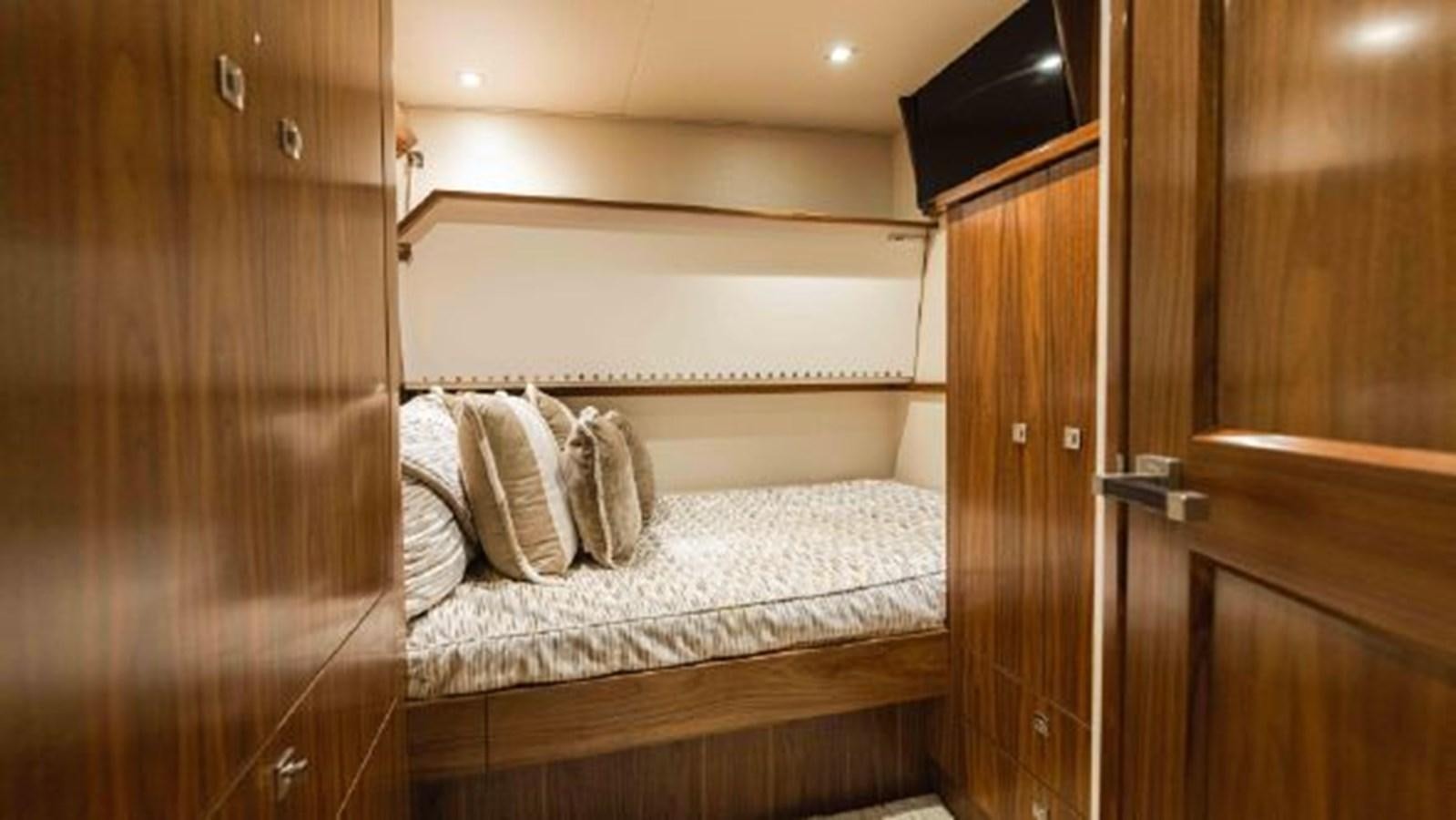 a bed in a room aboard MAKARA Yacht for Sale