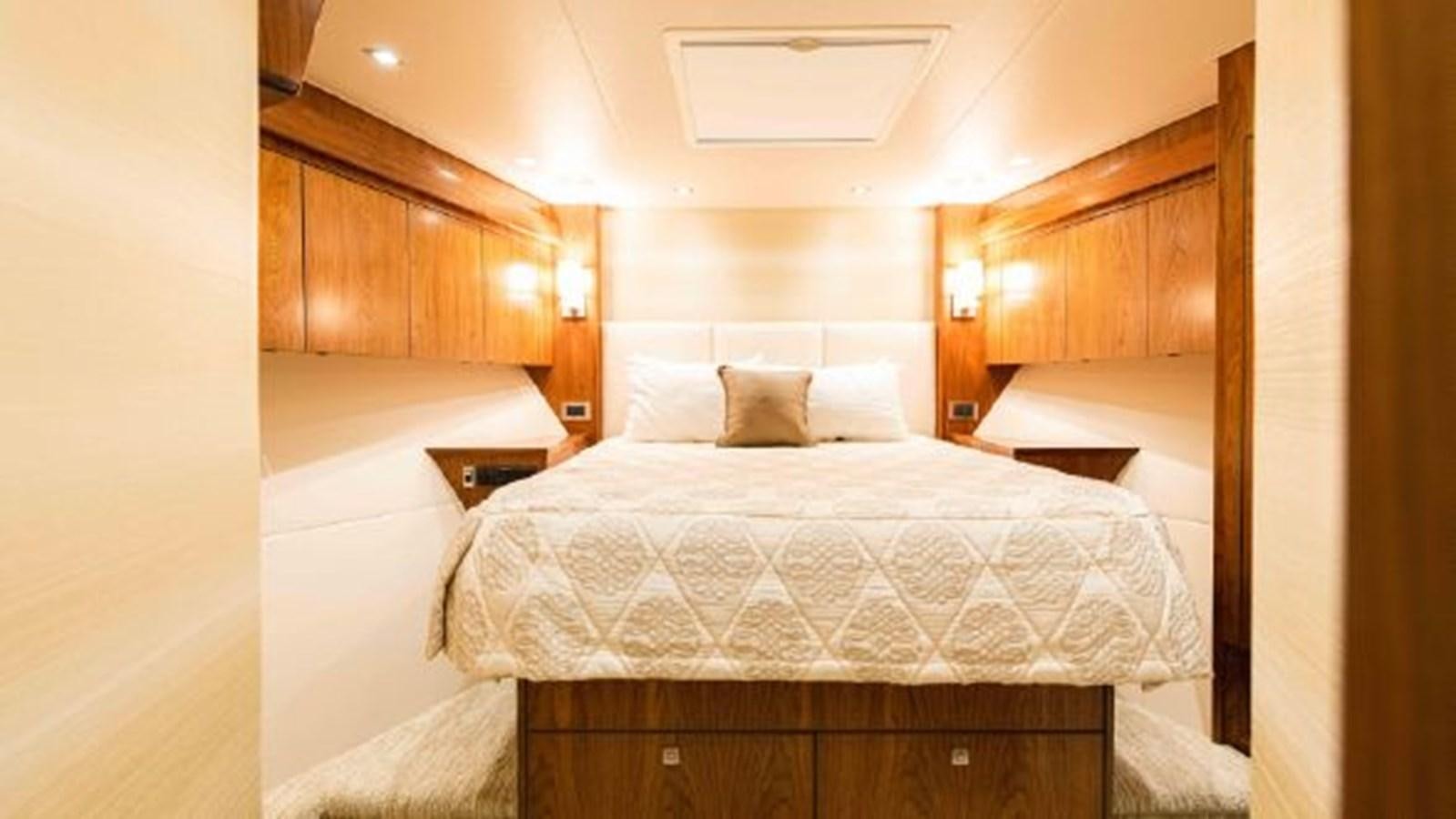 a bed in a room aboard MAKARA Yacht for Sale