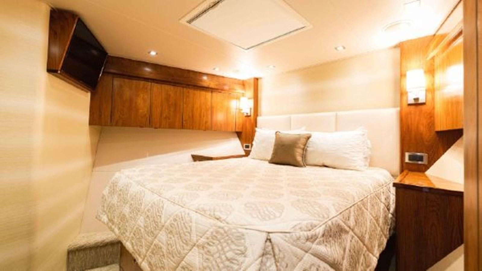 a bed with white sheets aboard MAKARA Yacht for Sale
