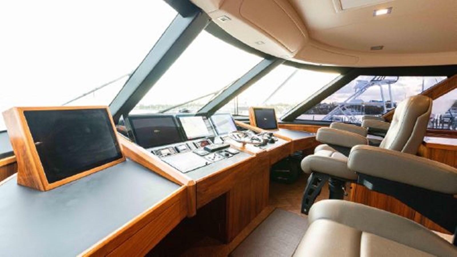 a room with a desk and laptops aboard MAKARA Yacht for Sale