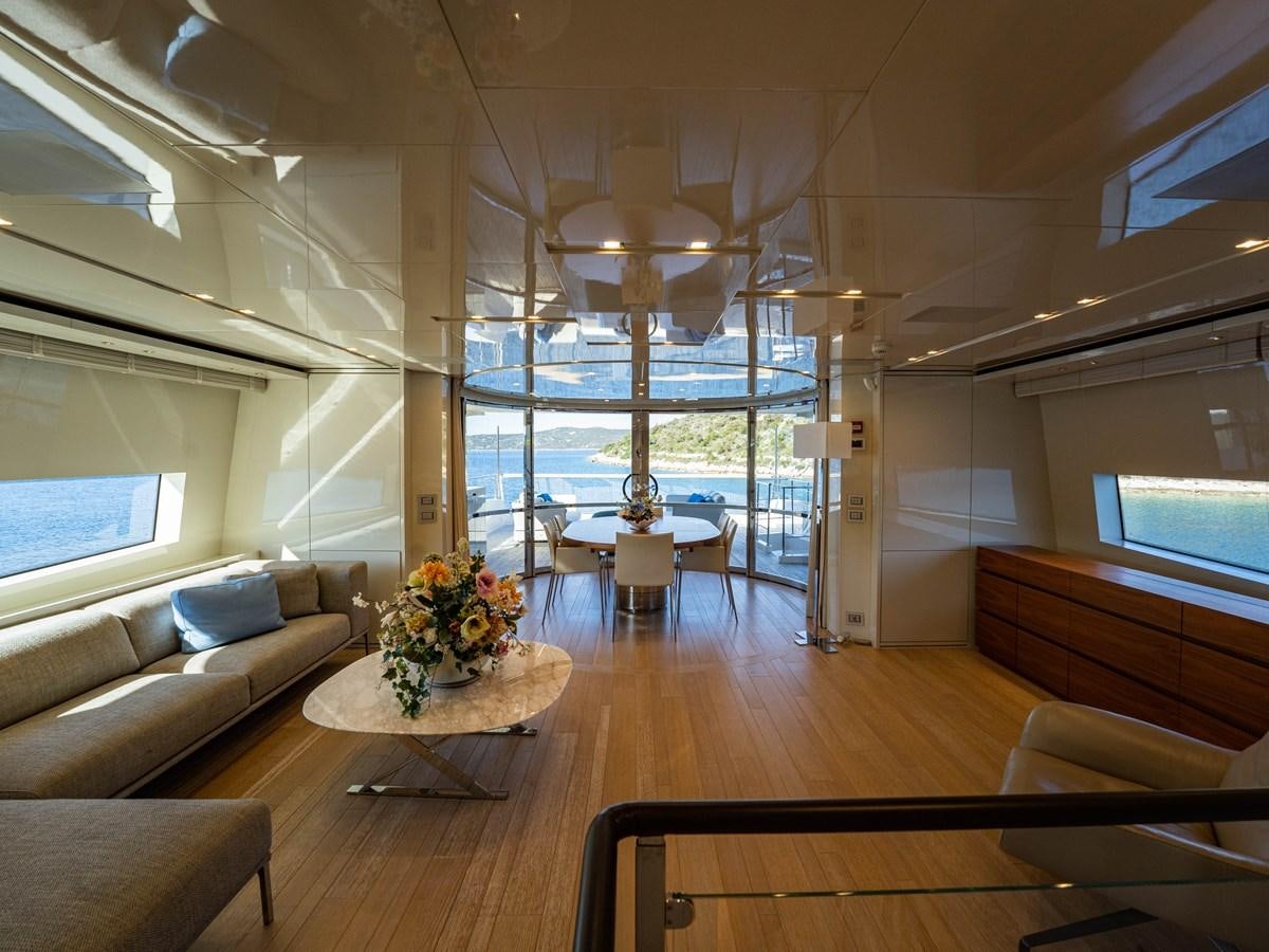 a room with a couch and a table and a window aboard BONITA II Yacht for Sale
