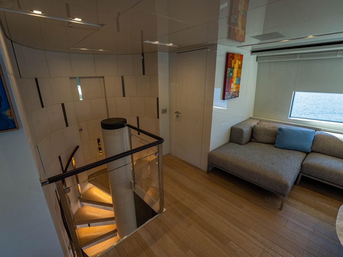 a living room with a couch and a table aboard BONITA II Yacht for Sale