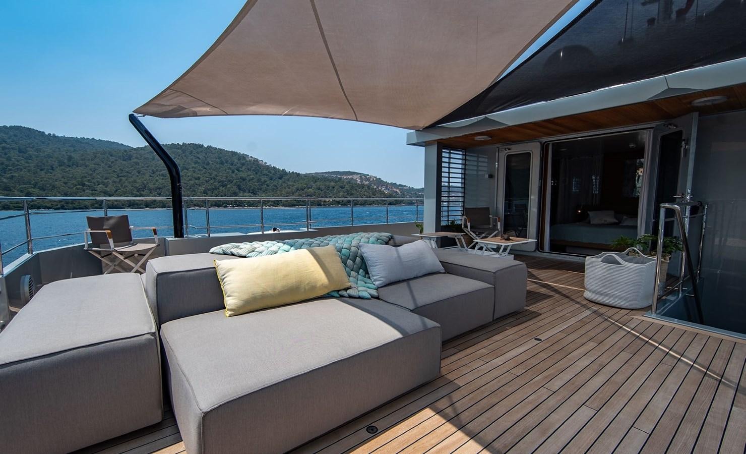 a large patio with a large body of water and a large patio aboard CALADAN Yacht for Sale