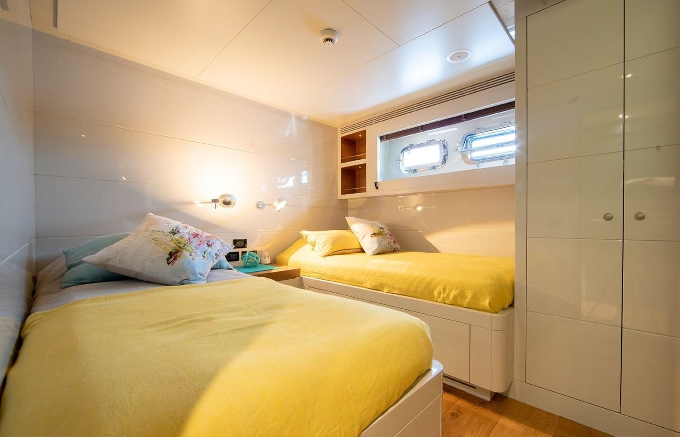a couple of beds in a room aboard CALADAN Yacht for Sale