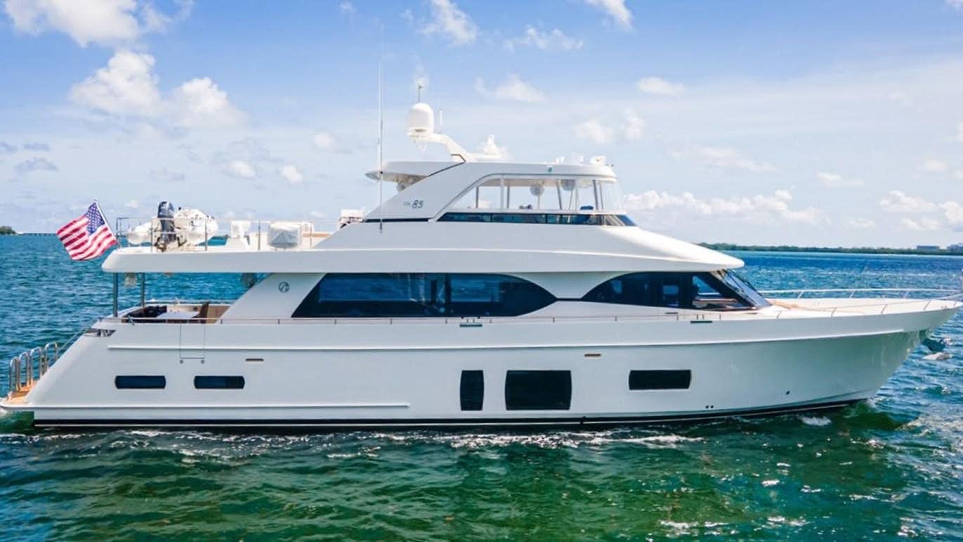 a white yacht in the water aboard PHOENIX Yacht for Sale