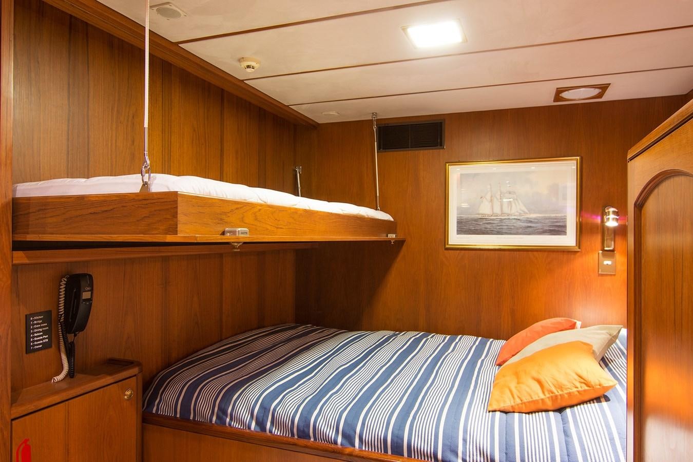 a bed in a cabin aboard MOONSHADOW NOA Yacht for Sale