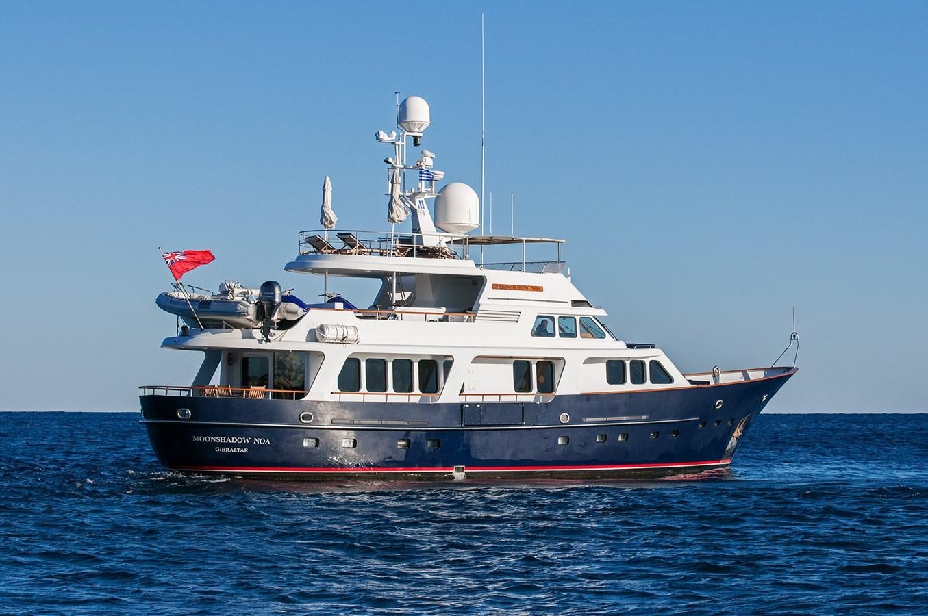 a large boat in the water aboard MOONSHADOW NOA Yacht for Sale
