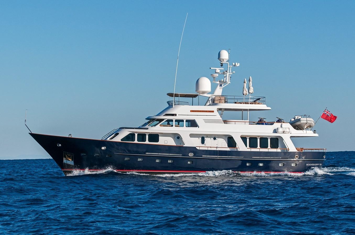 a large ship in the water aboard MOONSHADOW NOA Yacht for Sale