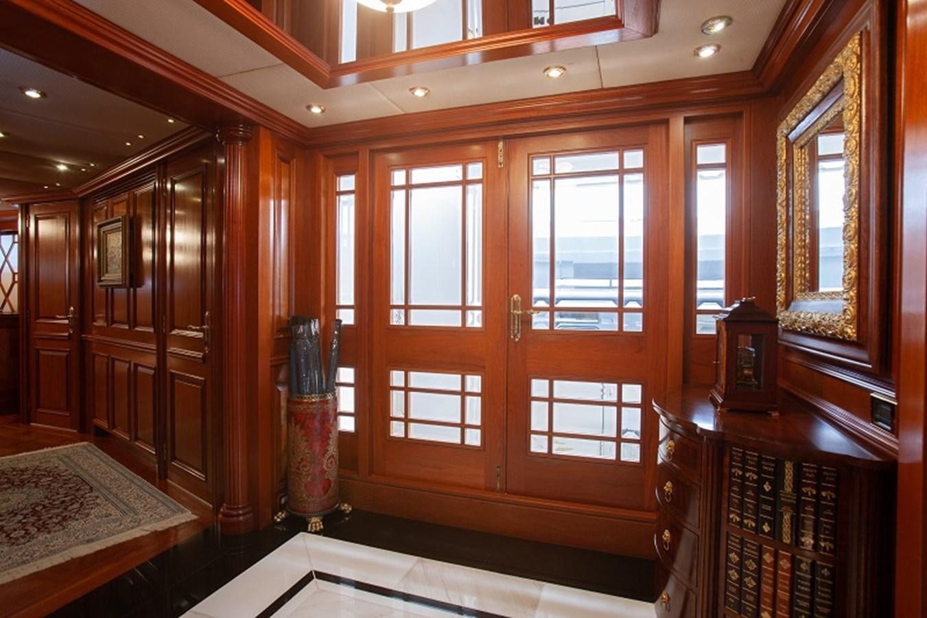 a room with wooden cabinets aboard BLUE STAR Yacht for Sale