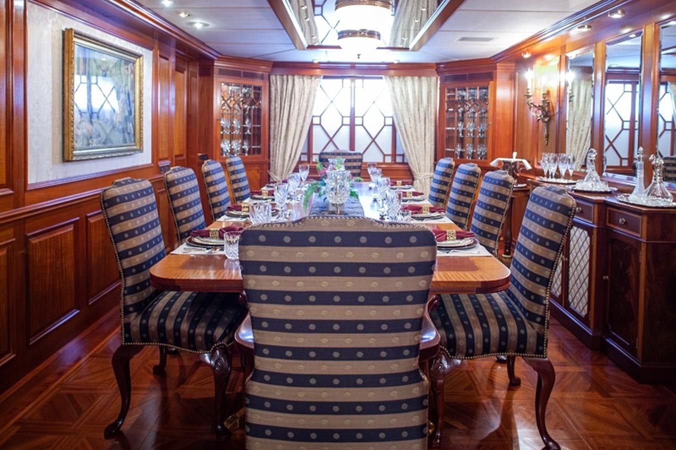 a dining room with a table aboard BLUE STAR Yacht for Sale