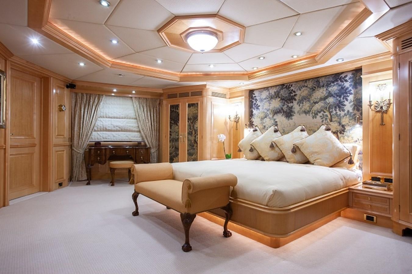 a large room with a couch and piano aboard BLUE STAR Yacht for Sale