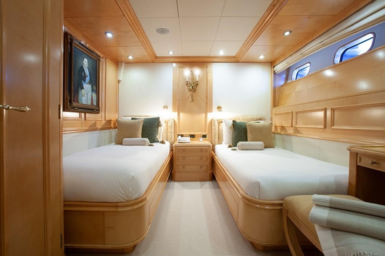 a bathroom with a bed and a chair aboard BLUE STAR Yacht for Sale