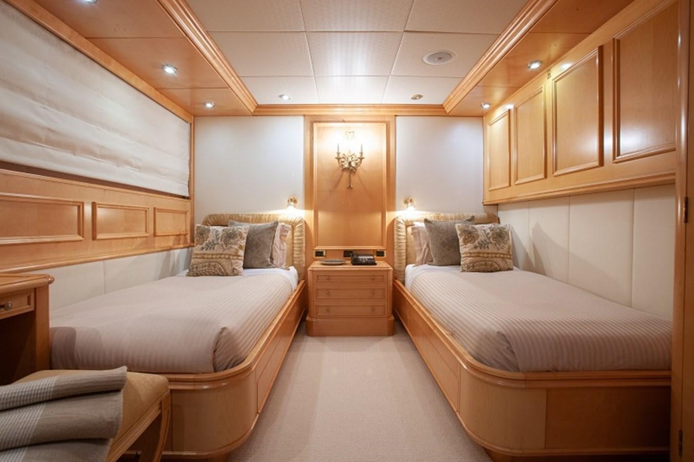 a room with a couple of beds aboard BLUE STAR Yacht for Sale