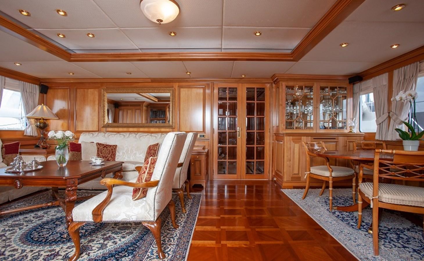 a living room with a table and chairs aboard BLUE STAR Yacht for Sale