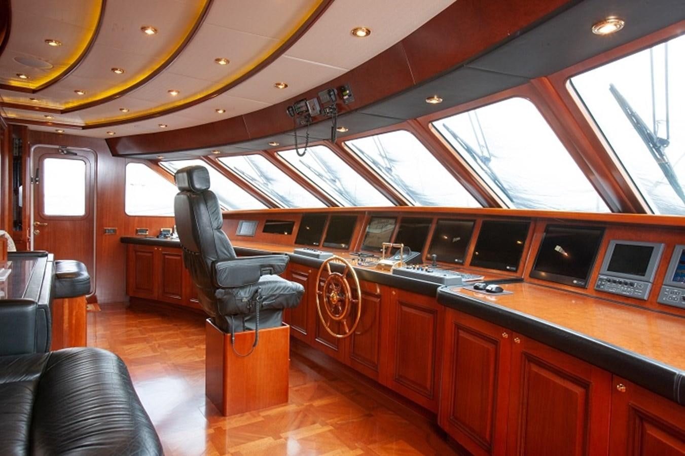 a room with a large desk and chairs aboard BLUE STAR Yacht for Sale