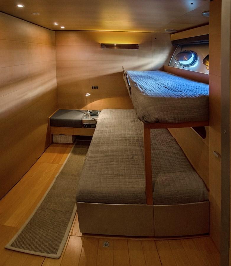 a bed in a room aboard NOT GUILTY III Yacht for Sale