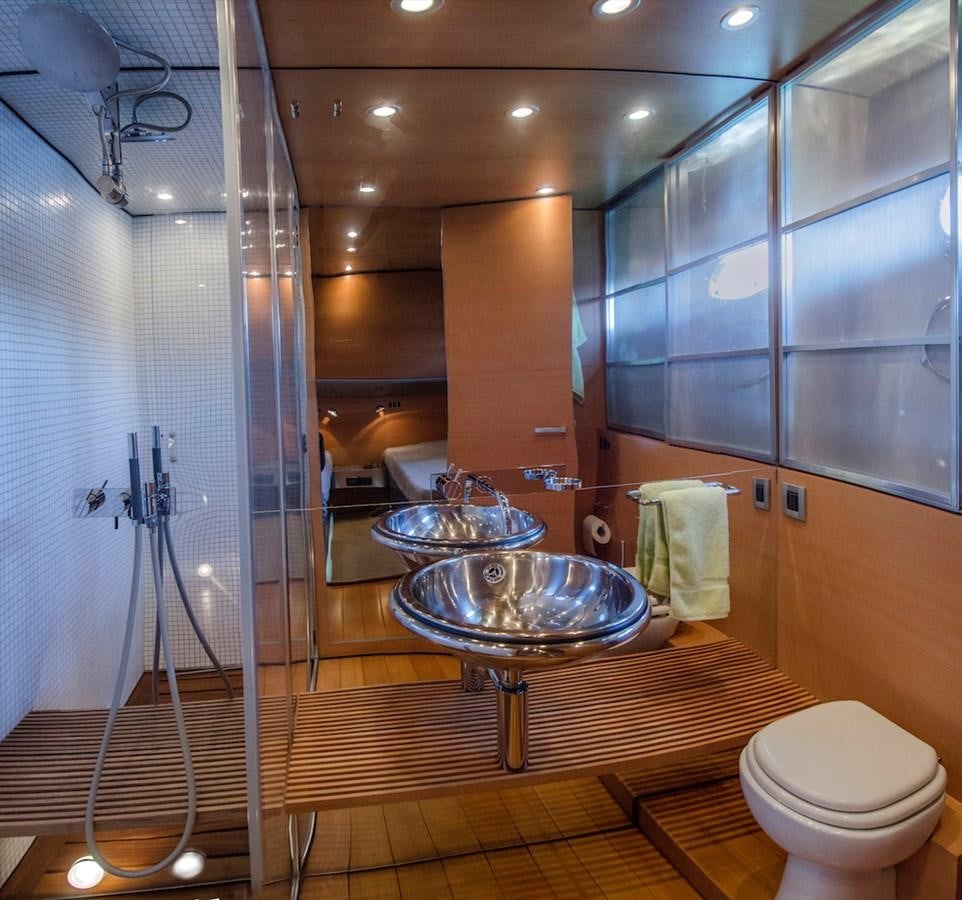 a bathroom with a glass shower aboard NOT GUILTY III Yacht for Sale