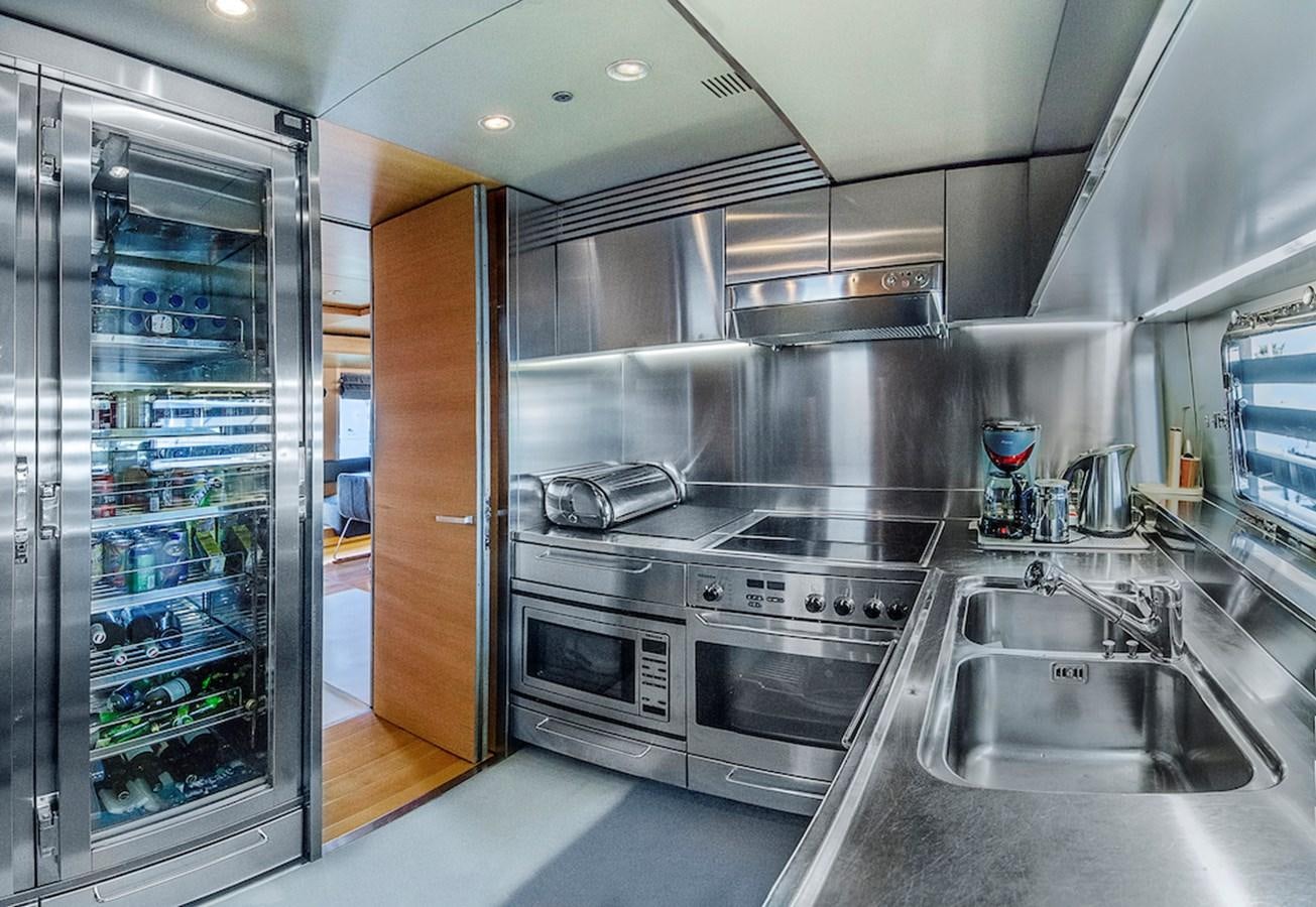 a kitchen with stainless steel appliances aboard NOT GUILTY III Yacht for Sale