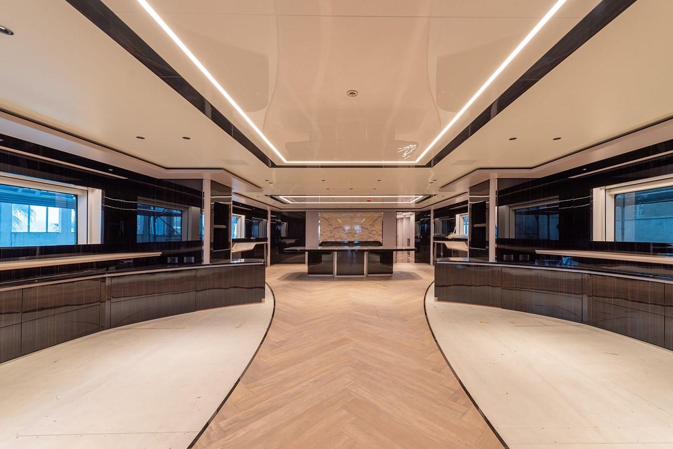 a long hallway with a large window aboard BARON TRENCK Yacht for Sale