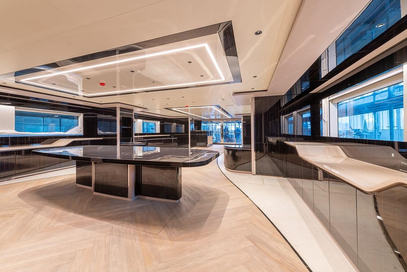 a room with a table and chairs aboard BARON TRENCK Yacht for Sale